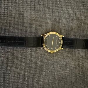 Bulova Men’s Quartz Diamond Accent Black Dial gold case watch 38mm